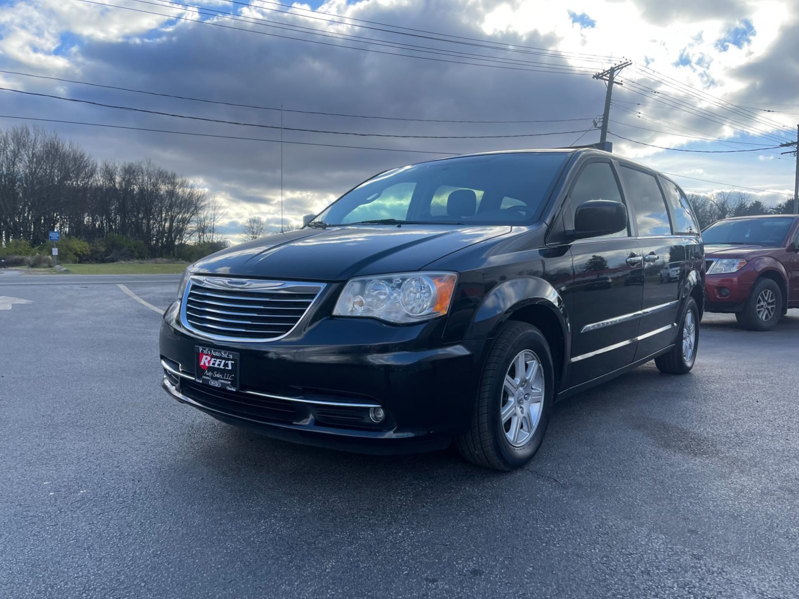 2012 Black /Black Chrysler Town & Country (2C4RC1BG0CR) with an 3.6L V6 DOHC 24V FFV engine, 6-Speed Automatic transmission, located at 11115 Chardon Rd. , Chardon, OH, 44024, (440) 214-9705, 41.580246, -81.241943 - This 2012 Chrysler Town & Country Touring - L model features a luxurious interior with cloth seats that are heated for comfort, complemented by a heated steering wheel for added warmth in cooler weather. It comes equipped with a convenient tow package, enhancing its utility for pulling trailers or b - Photo #0